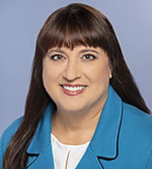 Picture of Dr. Kales with blue jacket, white shirt
